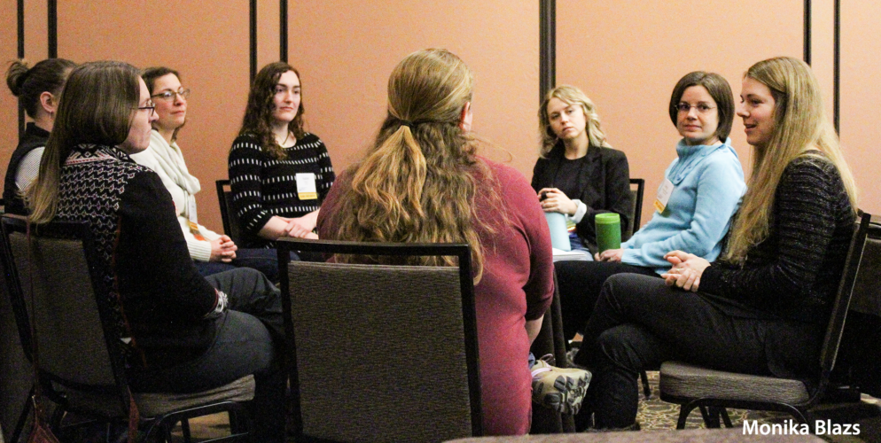 A group of women sit around a table during the Wisconsin Women's and Wetlands roundtable conversation at the 2023 Wetland Science Conference. Photo taken by Monika Blazs.